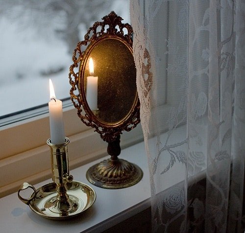 candle reflection flat mirror surface